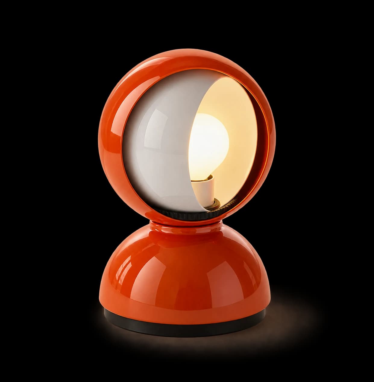 An orange Eclisse lamp with a curved white shutter